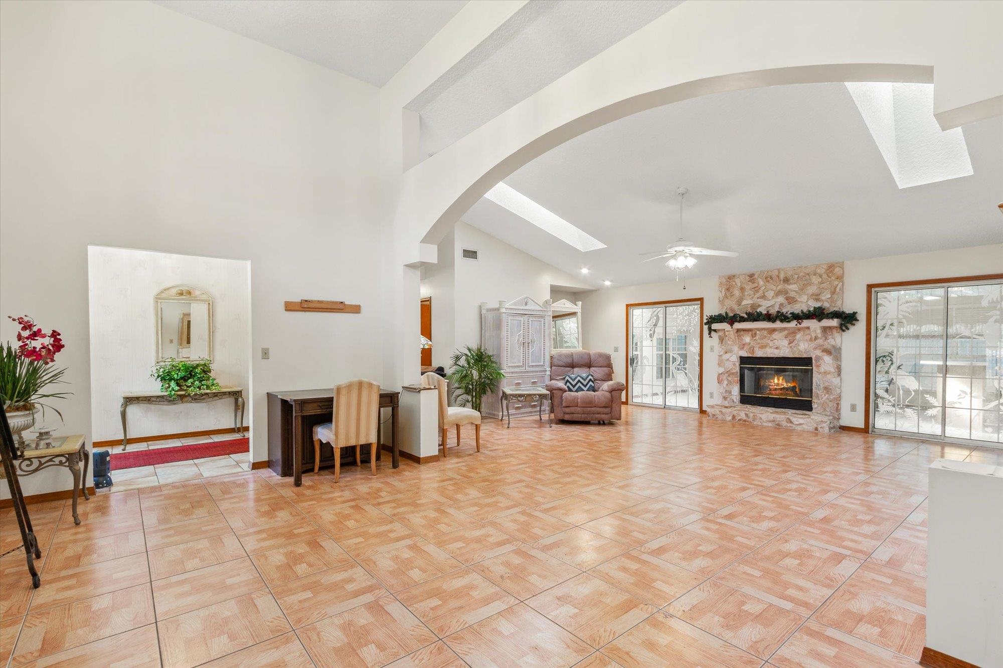 913 Chippewa Street St. Augustine, FL 32086 - Photo 5 of 56 a living room with furniture a fireplace and a flat screen tv