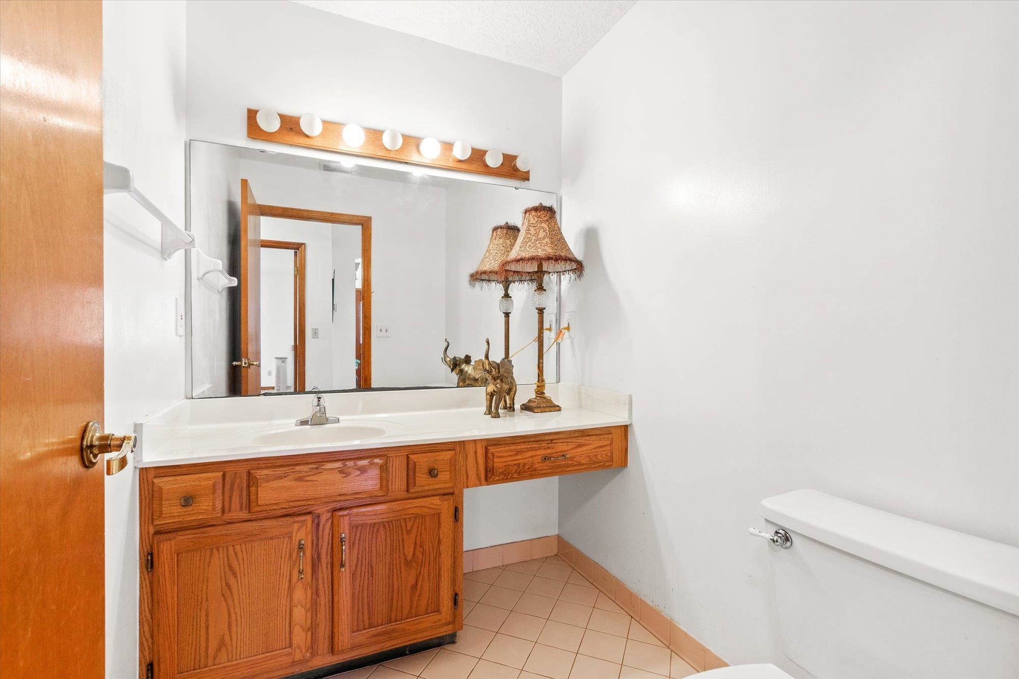 913 Chippewa Street St. Augustine, FL 32086 - Photo 9 of 56 a bathroom with a sink and a mirror