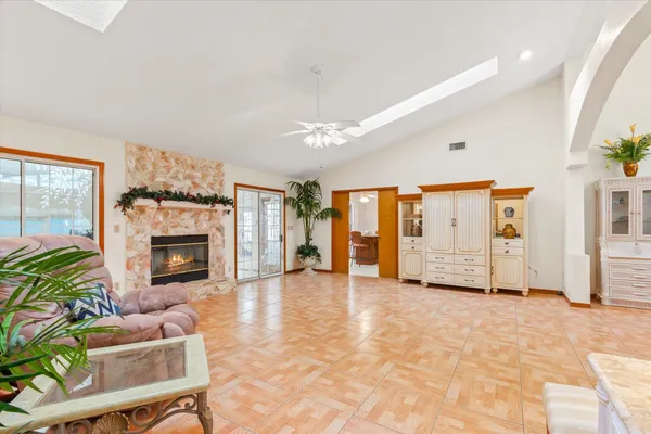 a kitchen with stainless steel appliances granite countertop a refrigerator stove top oven a sink and dishwasher