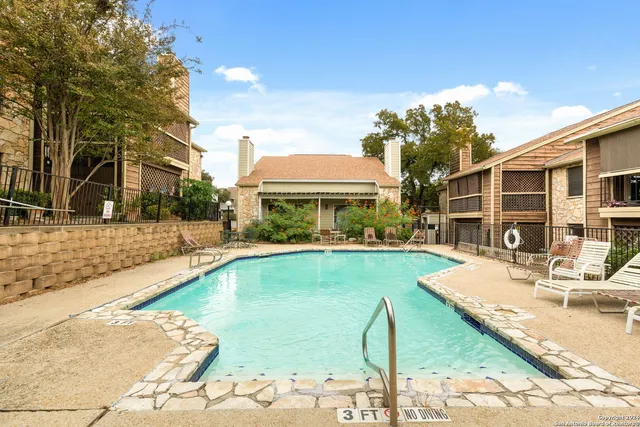 a view of a house with swimming pool
