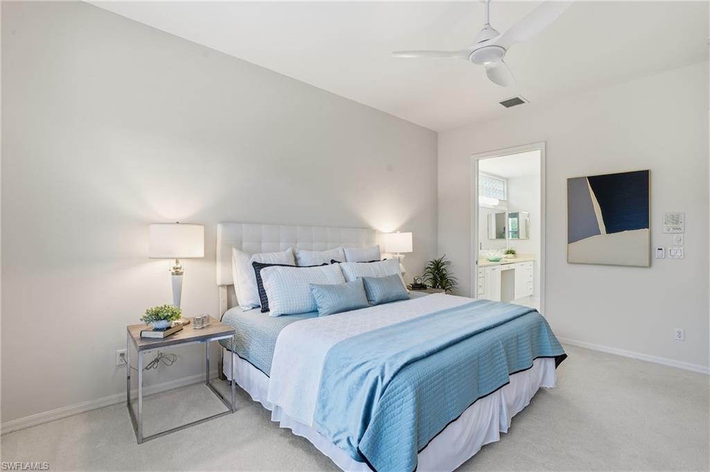 1737 Marsh Run Naples, FL 34109 - Photo 18 of 45 a bedroom with a bed and a tv