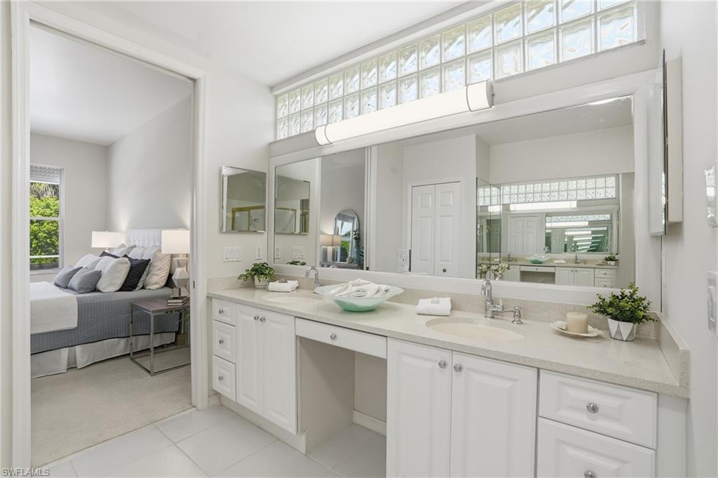 1737 Marsh Run Naples, FL 34109 - Photo 22 of 45 a bathroom with a granite countertop sink mirror and