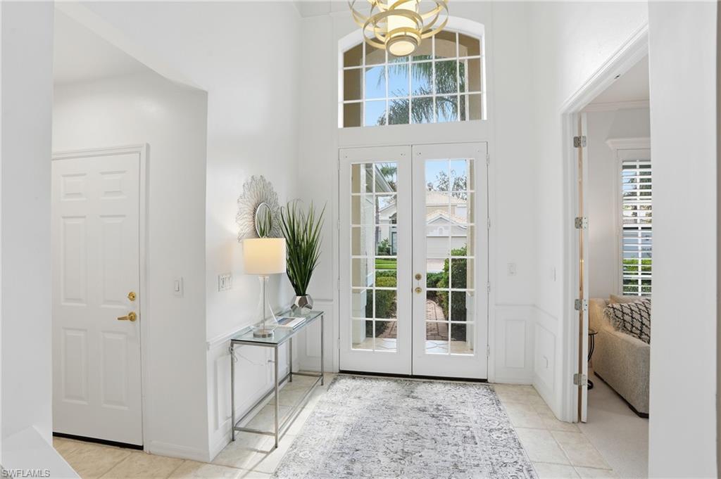 1737 Marsh Run Naples, FL 34109 - Photo 3 of 45 a view of a hallway with bathroom and front door