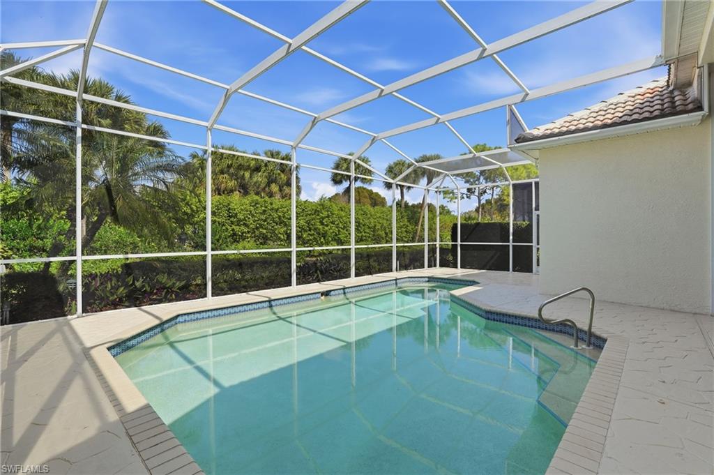 1737 Marsh Run Naples, FL 34109 - Photo 36 of 45 a view of a backyard with a swimming pool