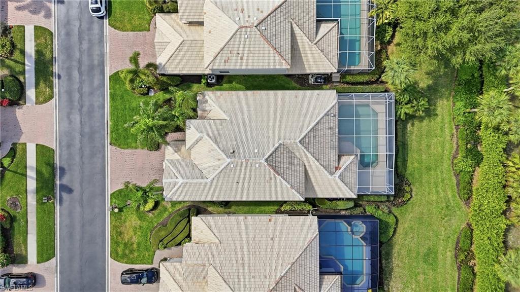 1737 Marsh Run Naples, FL 34109 - Photo 39 of 45 an aerial view of a house with a yard and large trees
