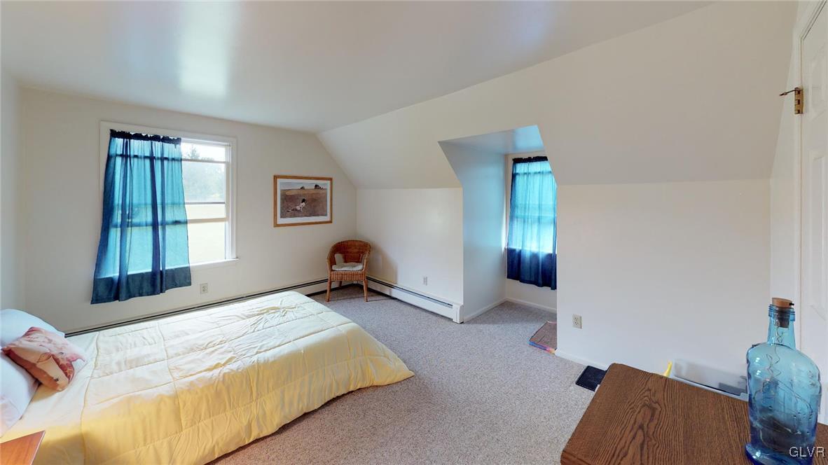 1740 Plains Road Pennsburg, PA 18073 - Photo 22 of 30 a bedroom with bed and window