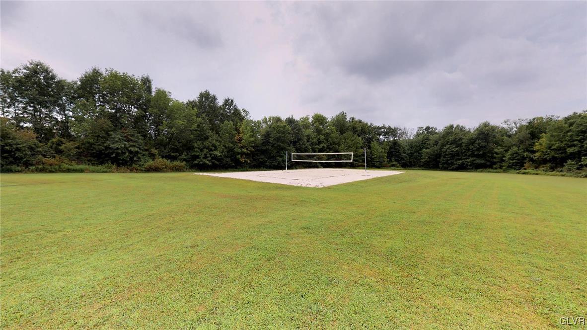 1740 Plains Road Pennsburg, PA 18073 - Photo 6 of 30 a view of a swimming pool and trees in the background
