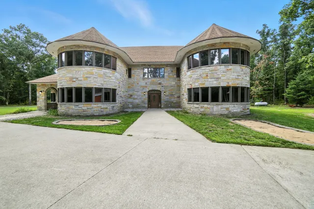 $995,000 | 2404 West 10 1/2 Mile Road, Irons, MI 49644