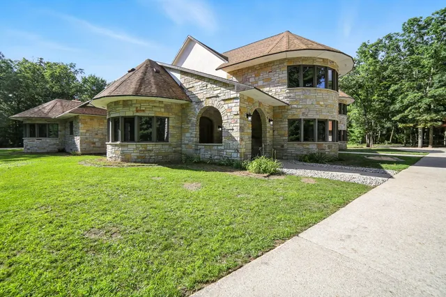 $995,000 | 2404 West 10 1/2 Mile Road, Irons, MI 49644