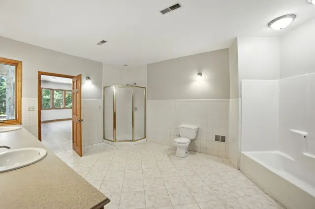 $995,000 | 2404 West 10 1/2 Mile Road, Irons, MI 49644