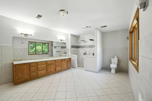 $995,000 | 2404 West 10 1/2 Mile Road, Irons, MI 49644