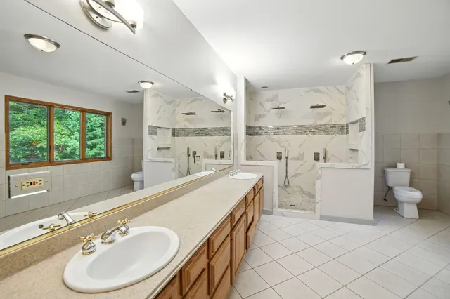 $995,000 | 2404 West 10 1/2 Mile Road, Irons, MI 49644