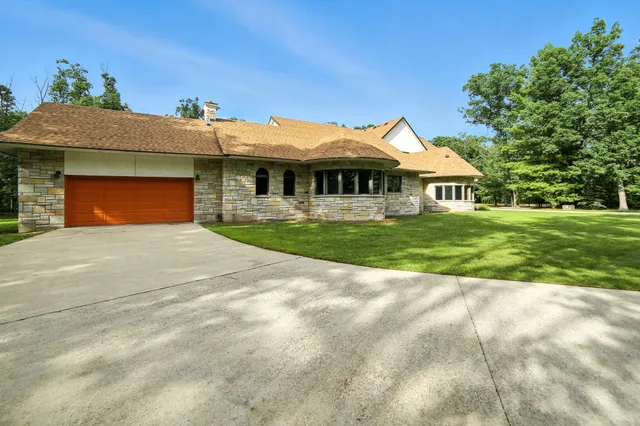 $995,000 | 2404 West 10 1/2 Mile Road, Irons, MI 49644