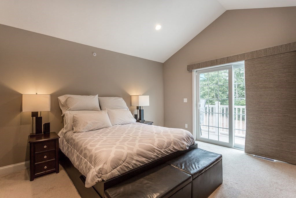 22 Highland Road, Unit 31 Raynham, MA 02767 - Photo 11 of 28 a bedroom with bed and large window