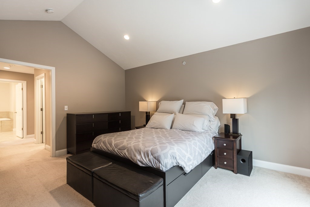 22 Highland Road, Unit 31 Raynham, MA 02767 - Photo 12 of 28 a bedroom with a bed and lamp