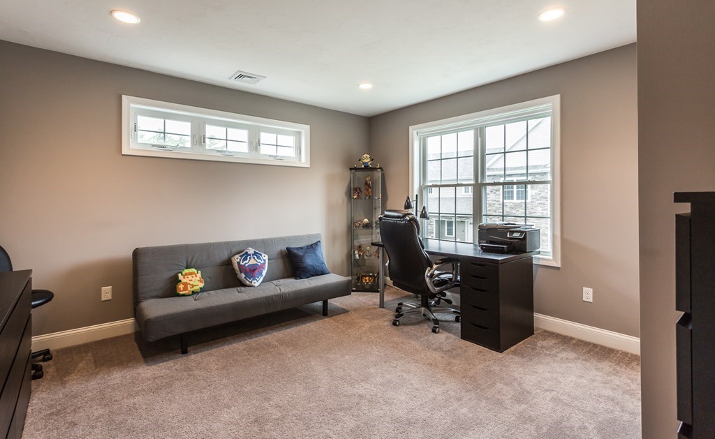 22 Highland Road, Unit 31 Raynham, MA 02767 - Photo 19 of 28 a living room with furniture and a window