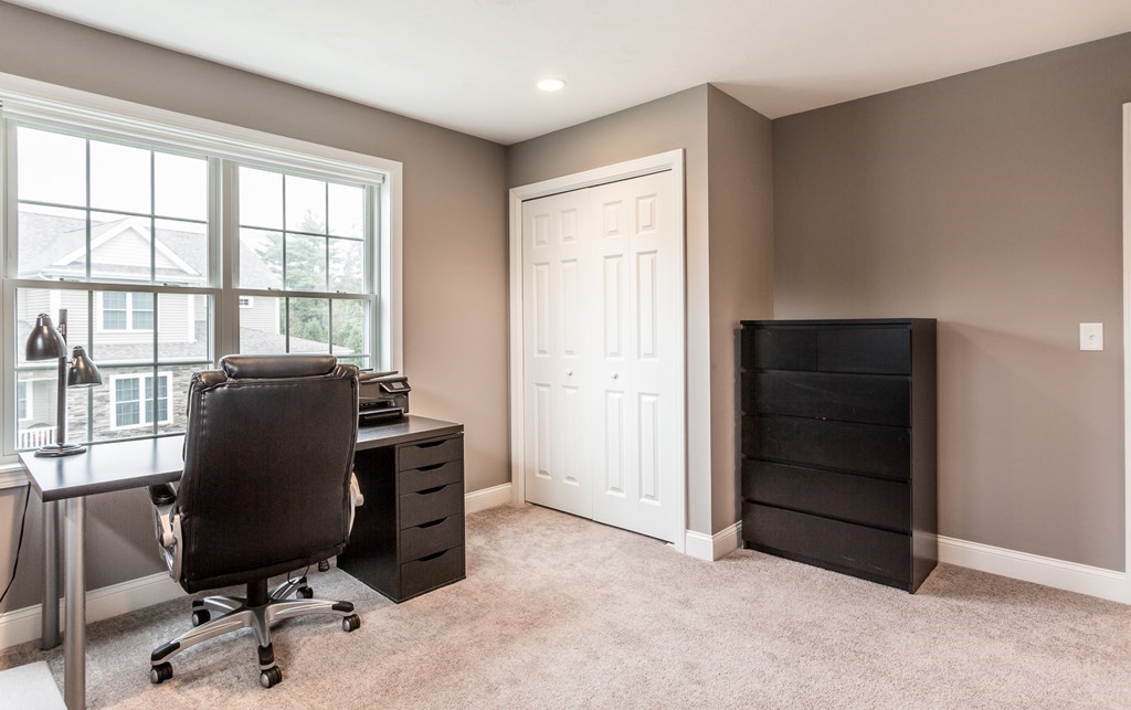 22 Highland Road, Unit 31 Raynham, MA 02767 - Photo 20 of 28 a view of a workspace with furniture and a window