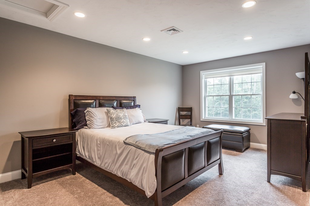 22 Highland Road, Unit 31 Raynham, MA 02767 - Photo 21 of 28 a bedroom with a bed and a window