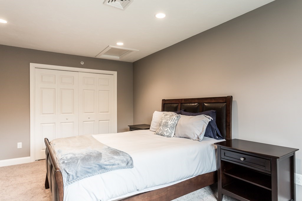 22 Highland Road, Unit 31 Raynham, MA 02767 - Photo 22 of 28 a bedroom with a bed and a window