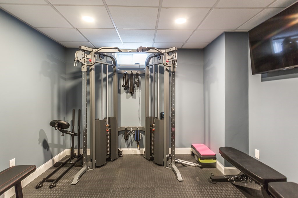 22 Highland Road, Unit 31 Raynham, MA 02767 - Photo 27 of 28 a view of a room with gym equipment