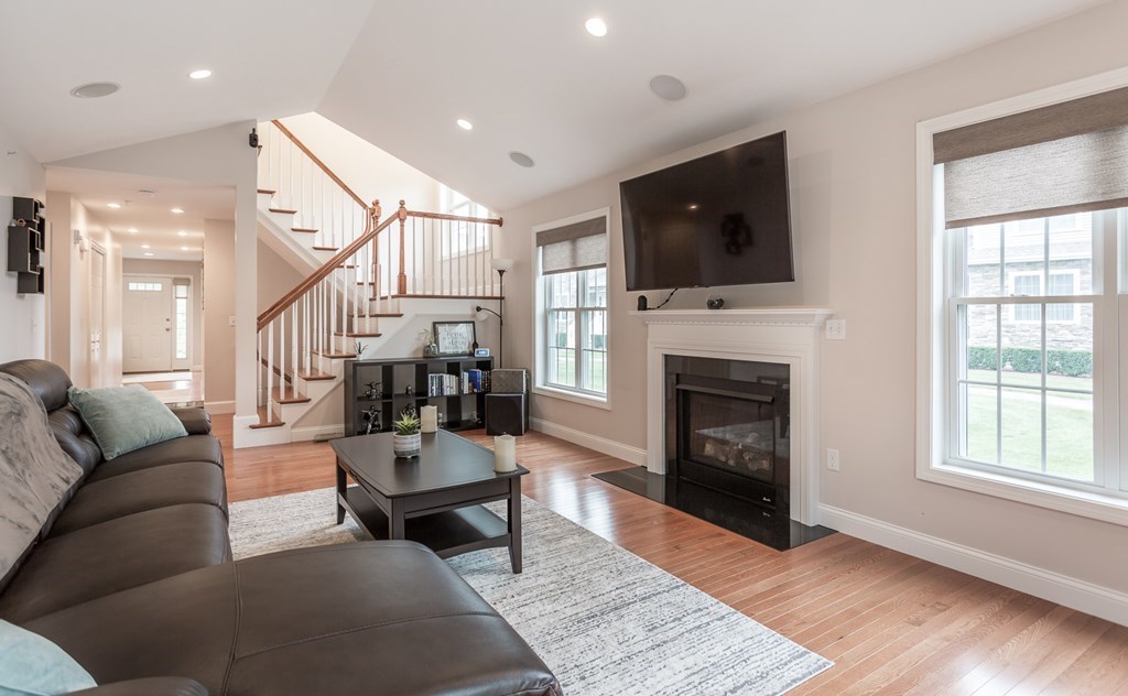 22 Highland Road, Unit 31 Raynham, MA 02767 - Photo 5 of 28 a living room with furniture fireplace and flat screen tv