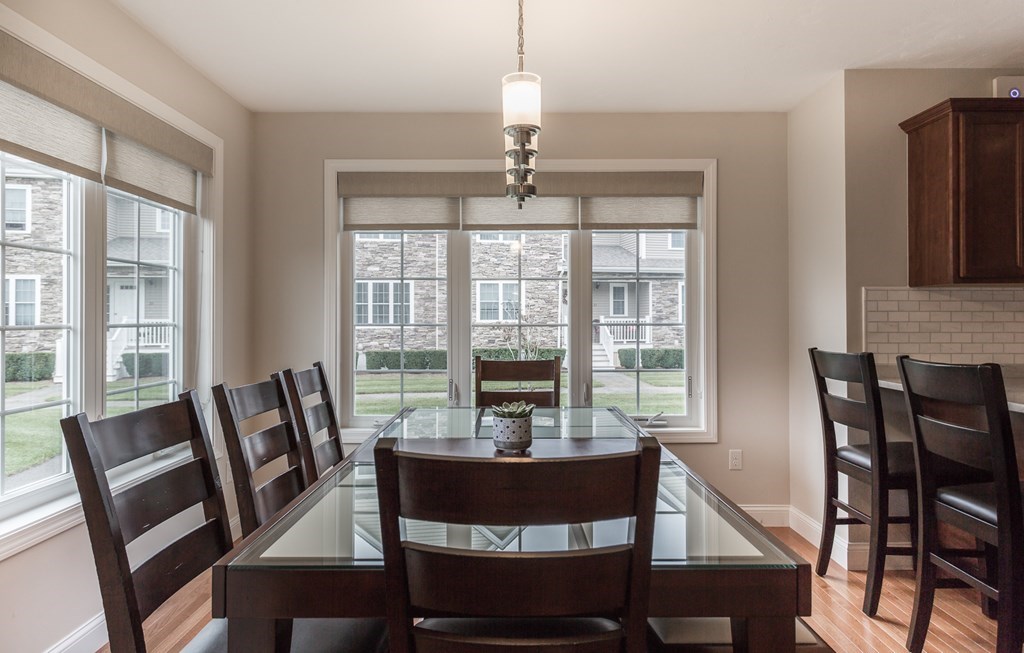22 Highland Road, Unit 31 Raynham, MA 02767 - Photo 9 of 28 a view of a dining room with furniture window and outside view