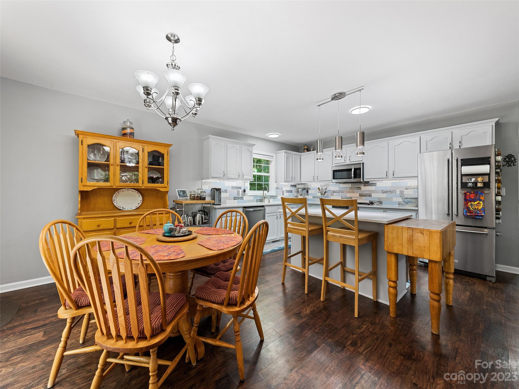 17 Secluded Trail Candler, NC 28715 - Photo 11 of 34 a view of a dining room with furniture and wooden floor
