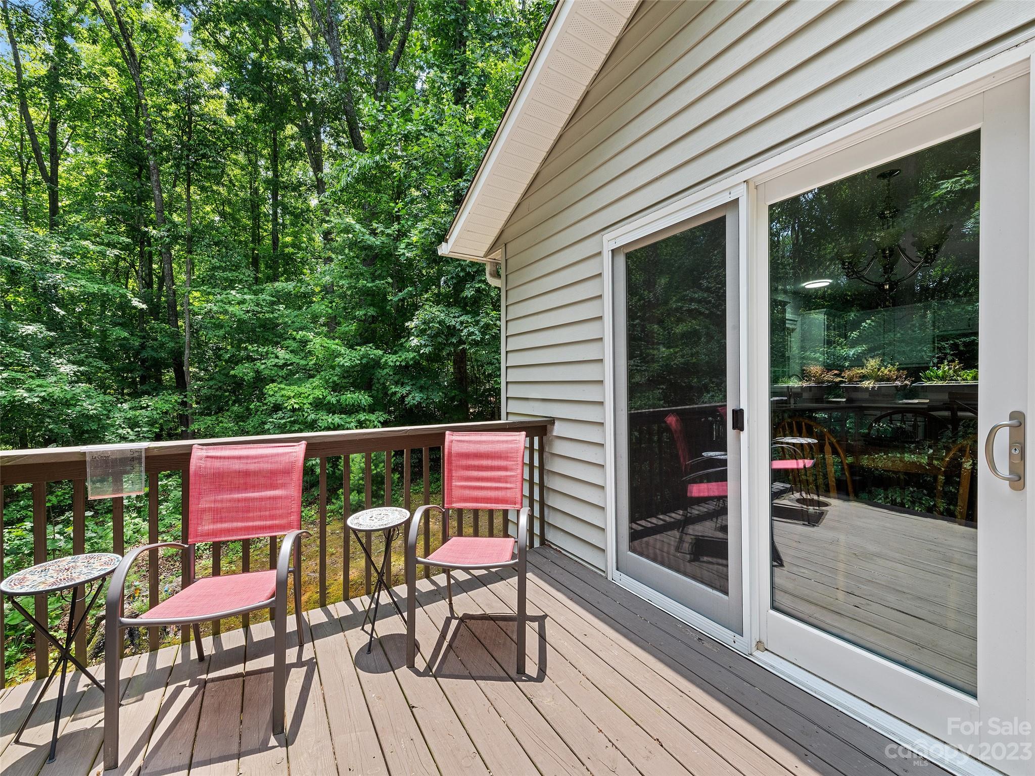 17 Secluded Trail Candler, NC 28715 - Photo 17 of 34 a patio with wooden floor and outdoor seating
