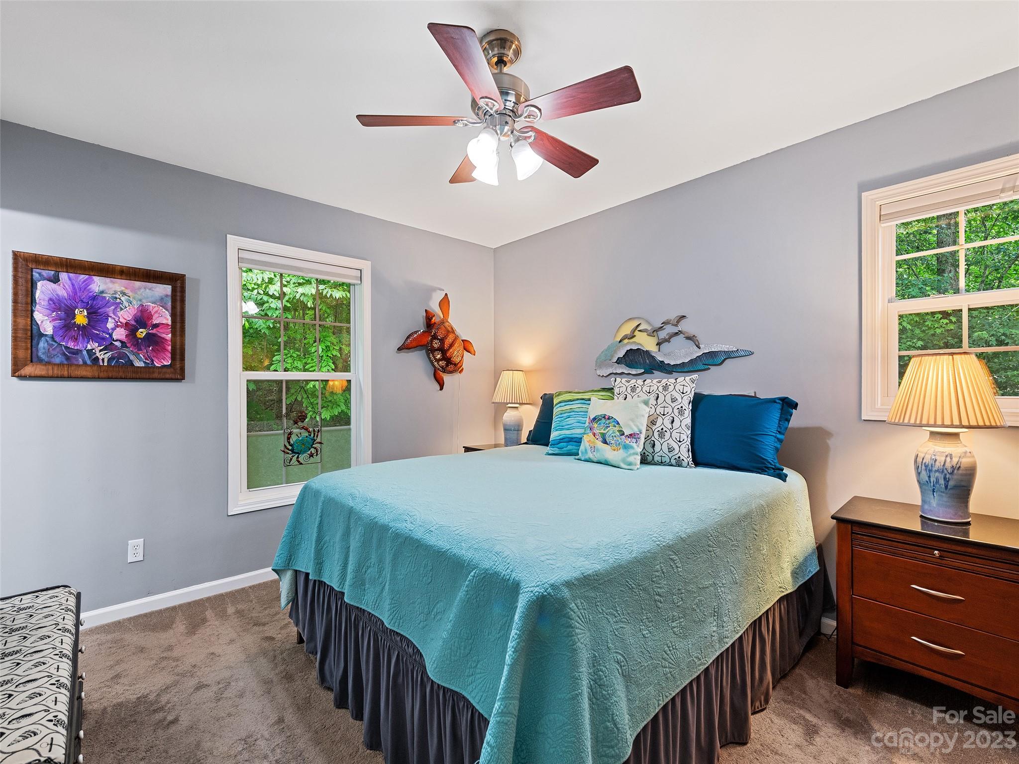 17 Secluded Trail Candler, NC 28715 - Photo 18 of 34 a bedroom with a bed a dresser and a large window