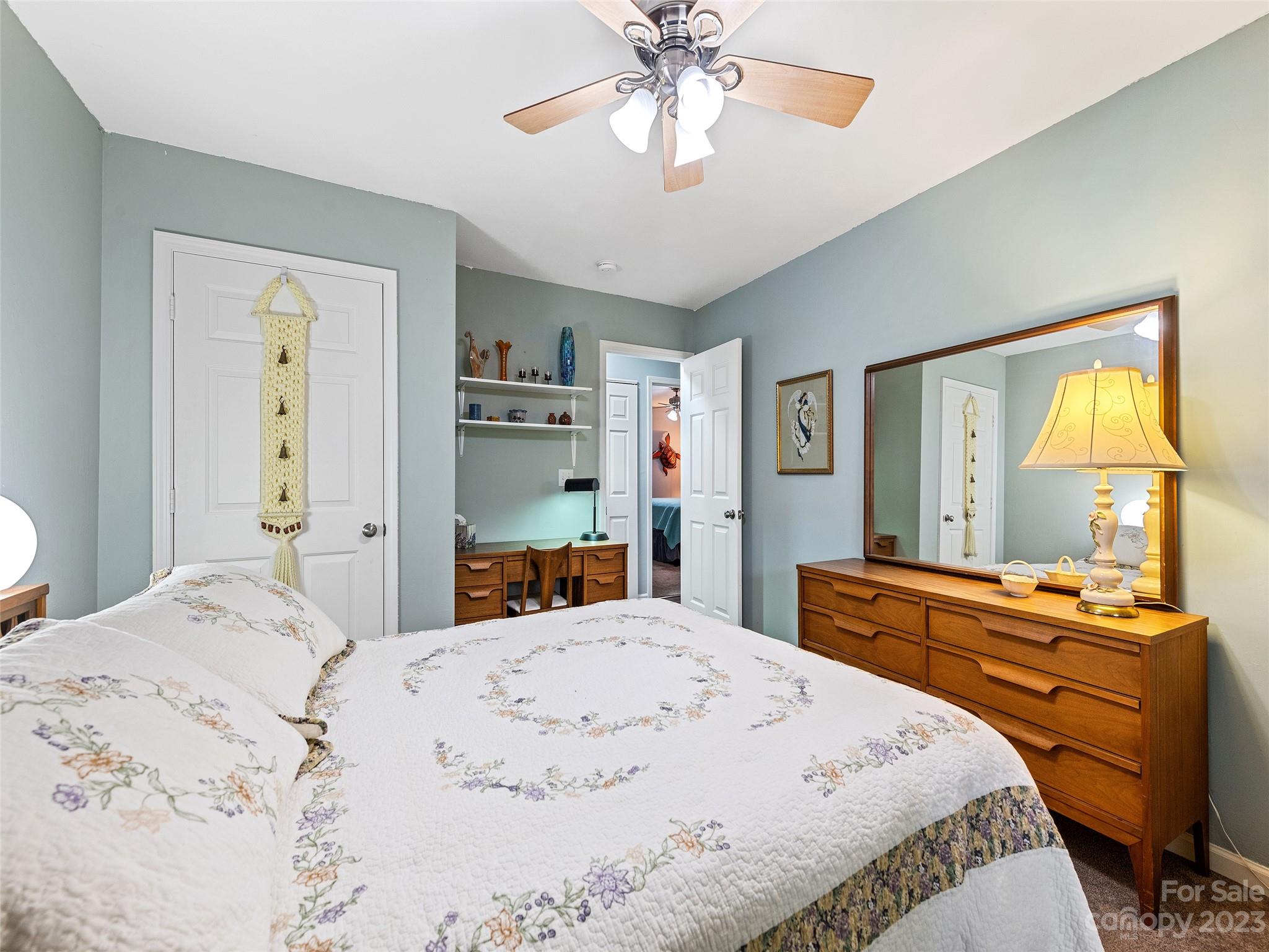 17 Secluded Trail Candler, NC 28715 - Photo 22 of 34 a bedroom with a bed and a dresser