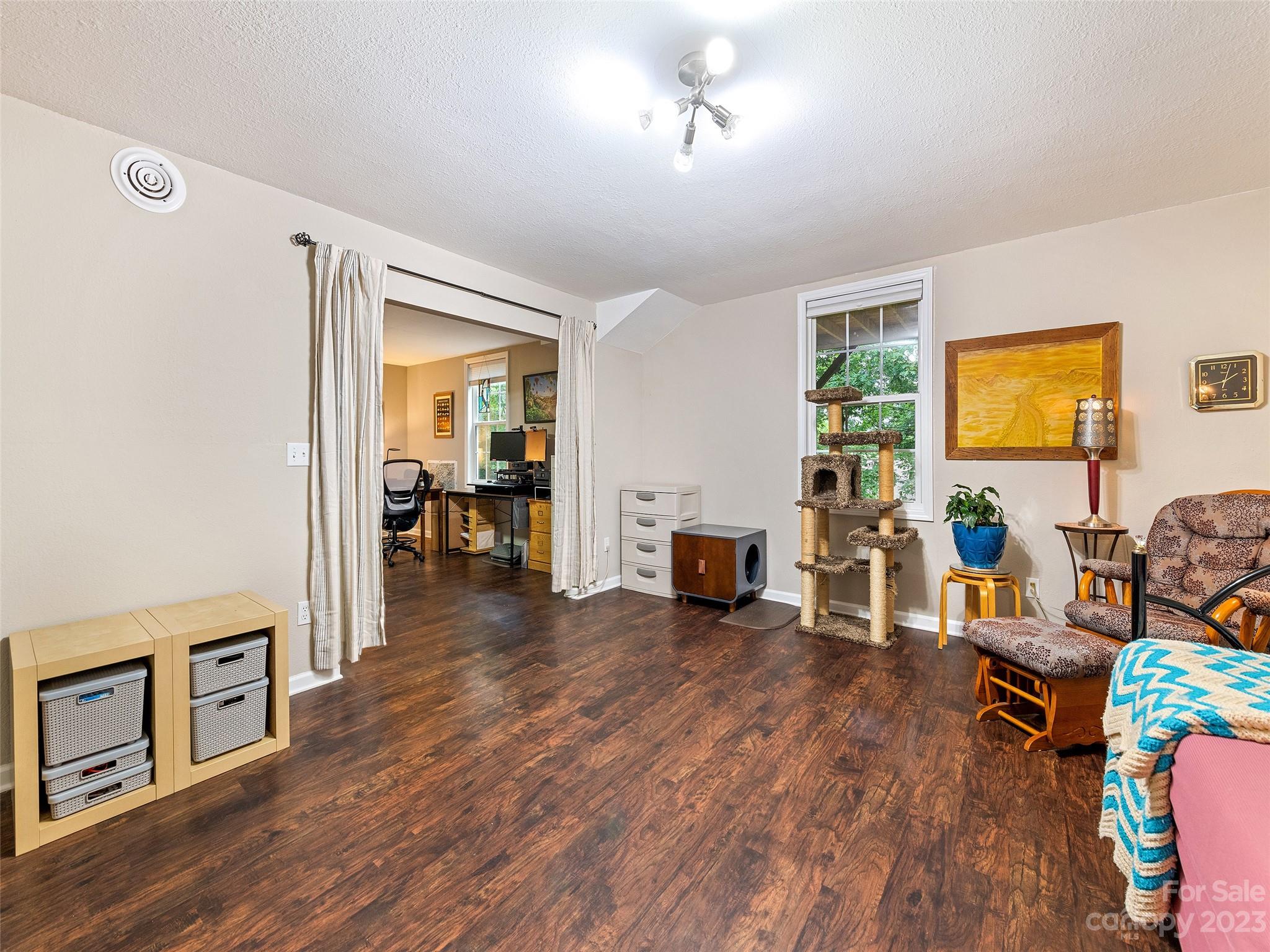 17 Secluded Trail Candler, NC 28715 - Photo 28 of 34 a living room with furniture and a flat screen tv