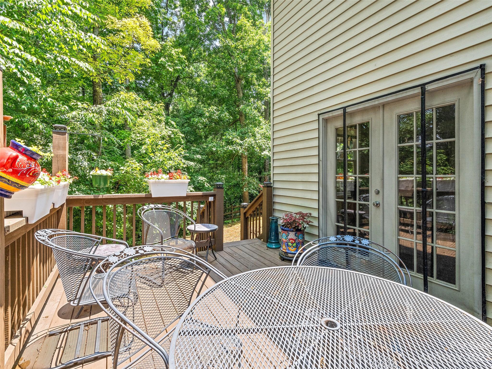 17 Secluded Trail Candler, NC 28715 - Photo 33 of 34 a view of a patio with couches table and chairs and potted plants