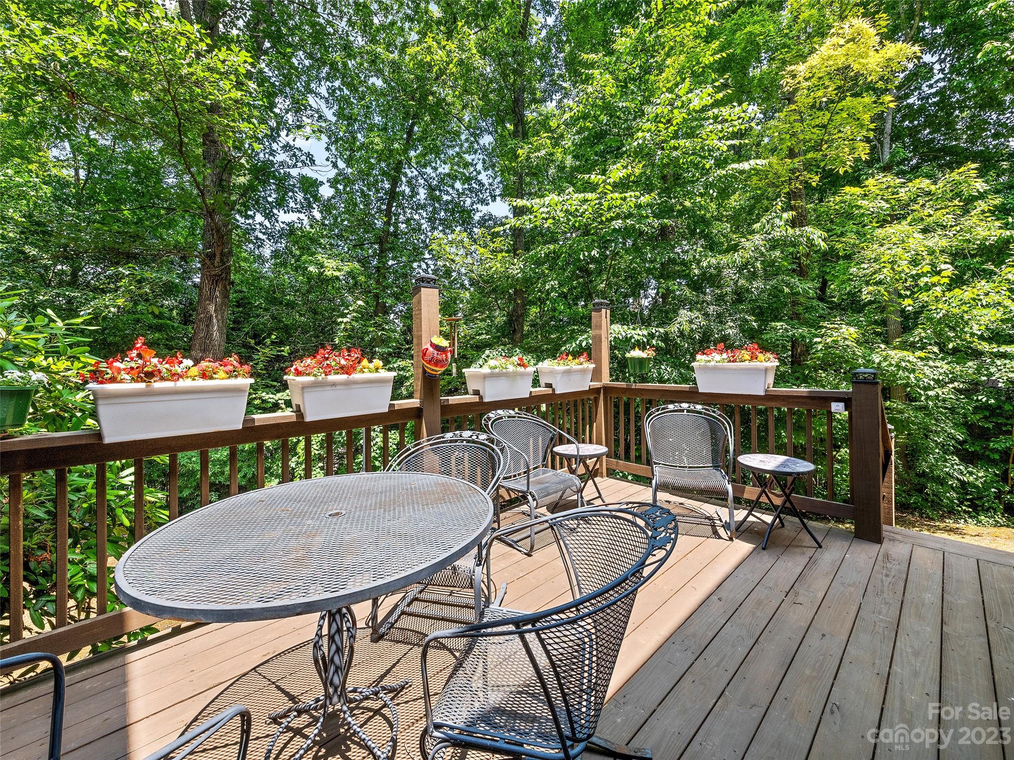17 Secluded Trail Candler, NC 28715 - Photo 34 of 34 a view of a chairs and table in patio with a barbeque