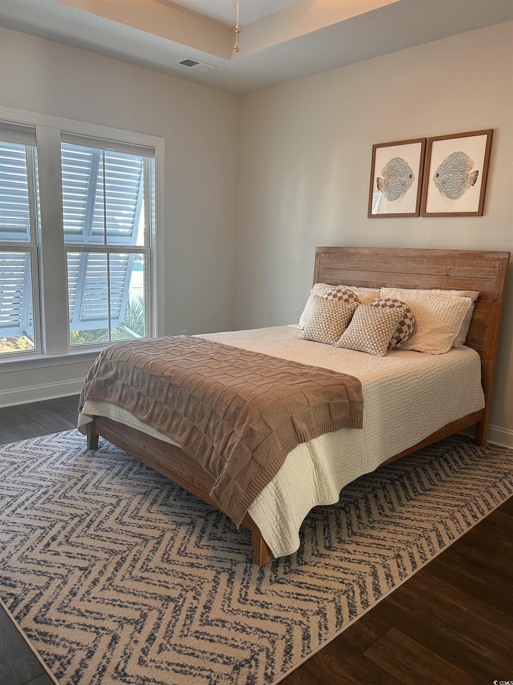535 Chanted Drive Murrells Inlet, SC 29576 - Photo 15 of 37 Bedroom with dark wood-style flooring and a raised ceiling