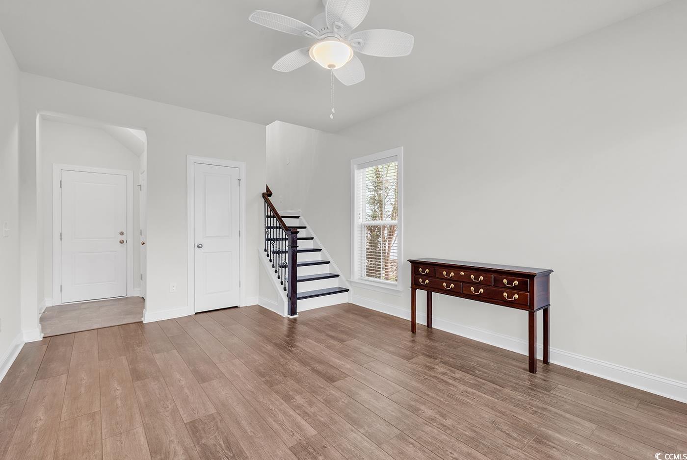 535 Chanted Drive Murrells Inlet, SC 29576 - Photo 22 of 37 Living room featuring wood finished floors, stairway, and ceiling fan