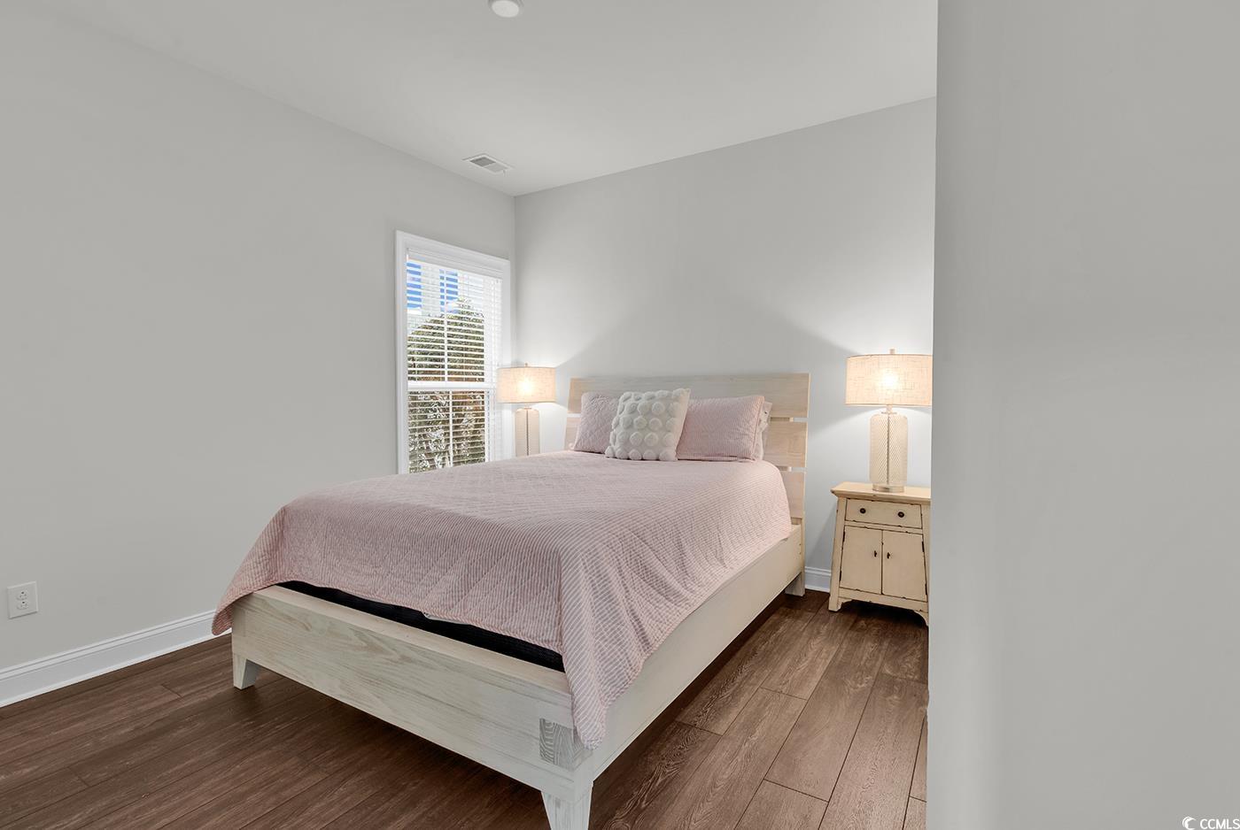 535 Chanted Drive Murrells Inlet, SC 29576 - Photo 24 of 37 Bedroom featuring wood finished floors and baseboards