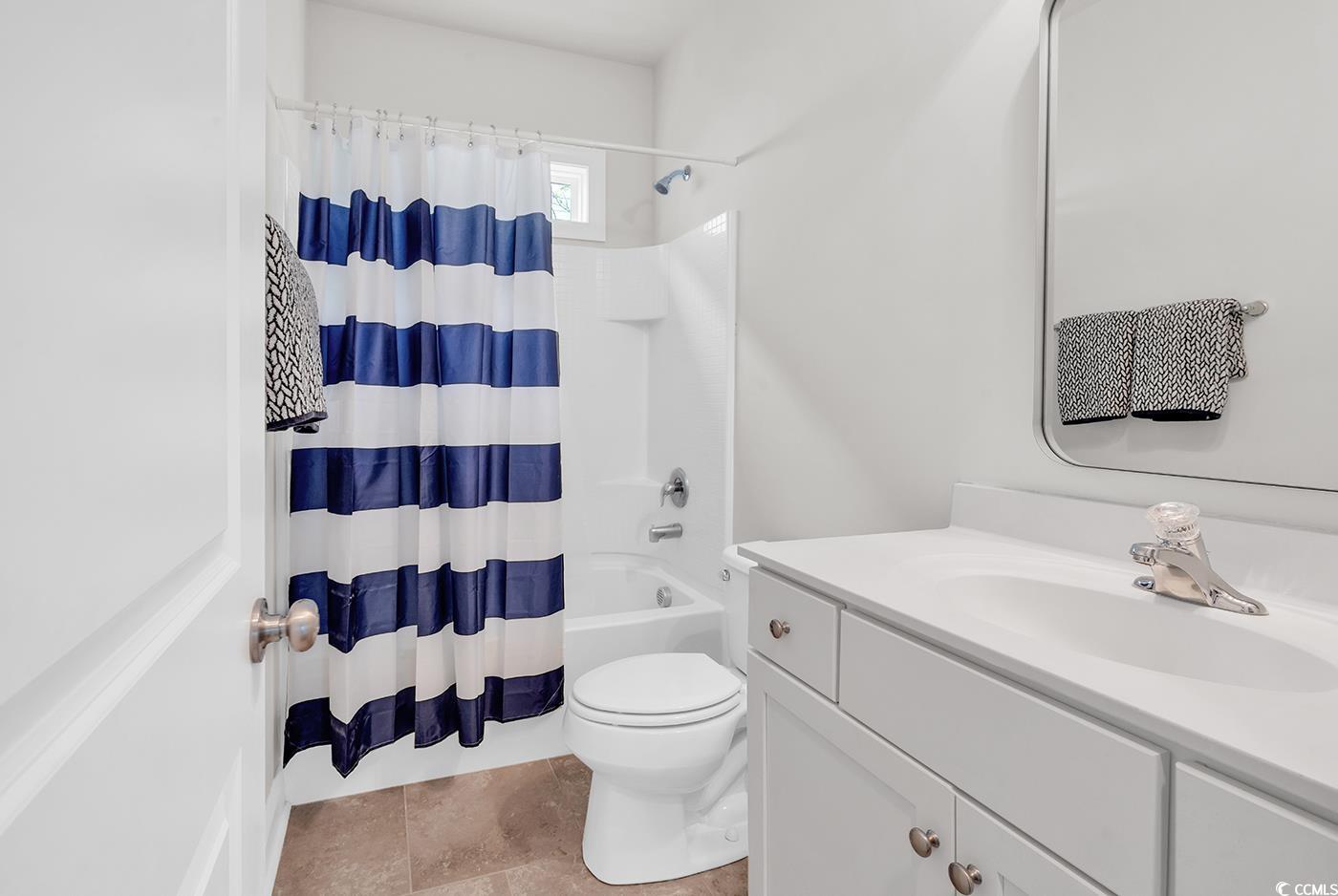 535 Chanted Drive Murrells Inlet, SC 29576 - Photo 25 of 37 Bathroom featuring vanity and shower / tub combo with curtain