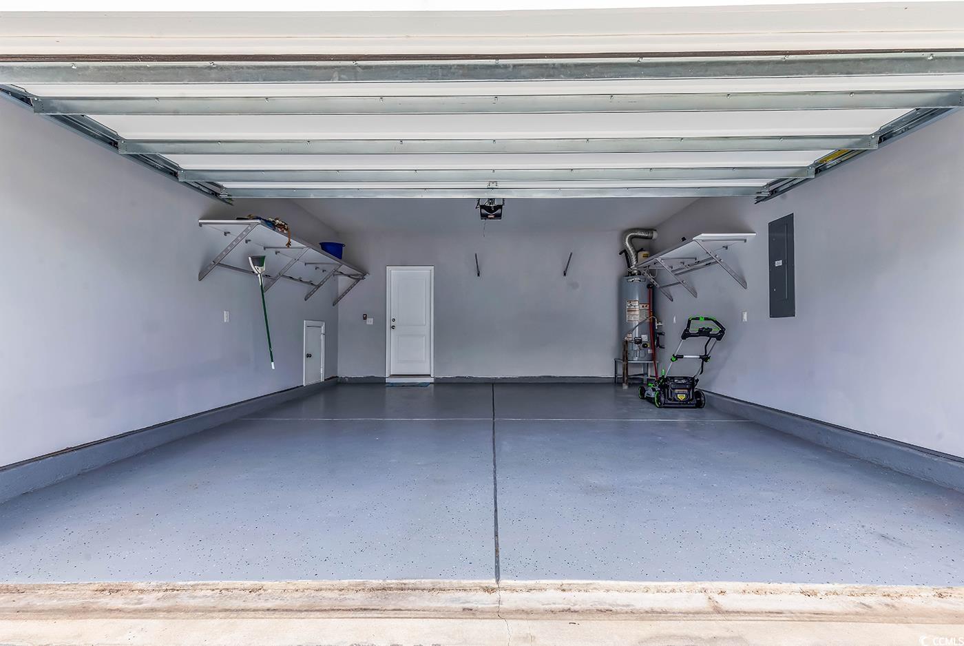 535 Chanted Drive Murrells Inlet, SC 29576 - Photo 31 of 37 Garage featuring water heater and electric panel