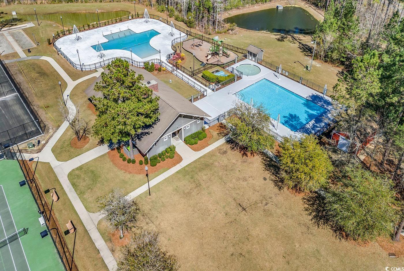 535 Chanted Drive Murrells Inlet, SC 29576 - Photo 35 of 37 Drone / aerial view of a pool and a large body of water