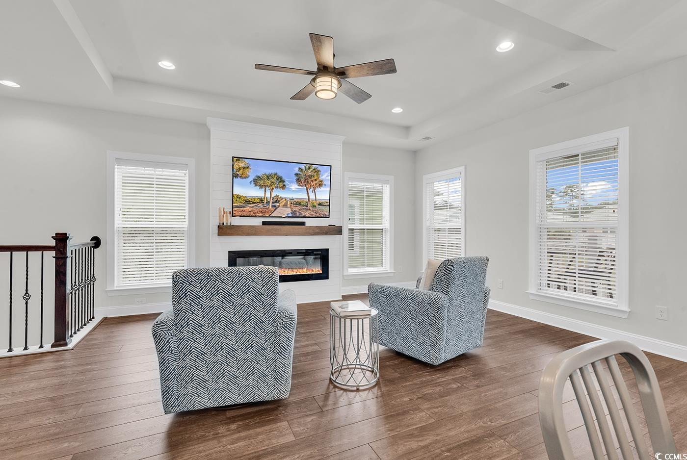 535 Chanted Drive Murrells Inlet, SC 29576 - Photo 8 of 37 Living room featuring a raised ceiling, dark wood-style floors, plenty of natural light, and recessed lighting