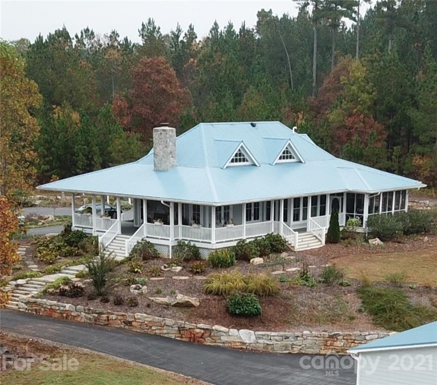 58 Pilot Ridge Road, Unit 29 Nebo, NC 28761 - Photo 20 of 32 a front view of a house with a garden
