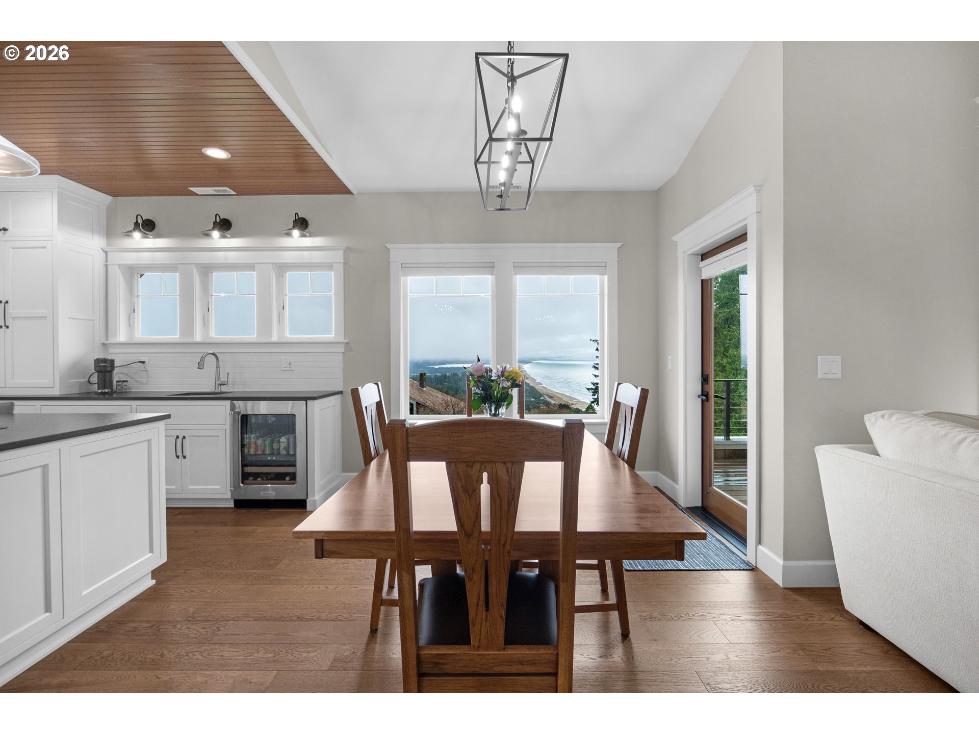 38590 Meadow Loop Nehalem, OR 97131 - Photo 10 of 48 a view of a dining room with furniture window and wooden floor