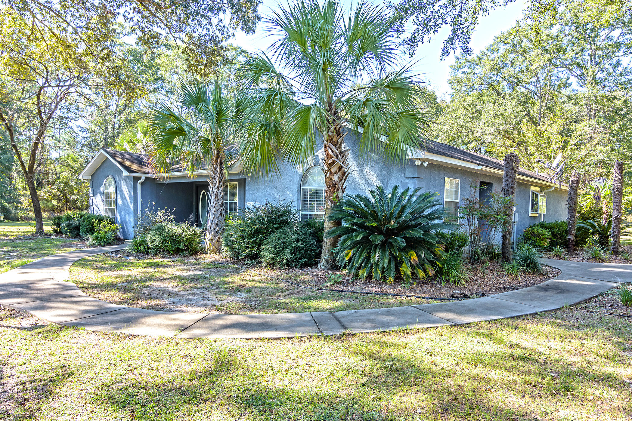 7262 Old River Road Baker, FL 32531 - Photo 2 of 63 a view of a house with a swimming pool