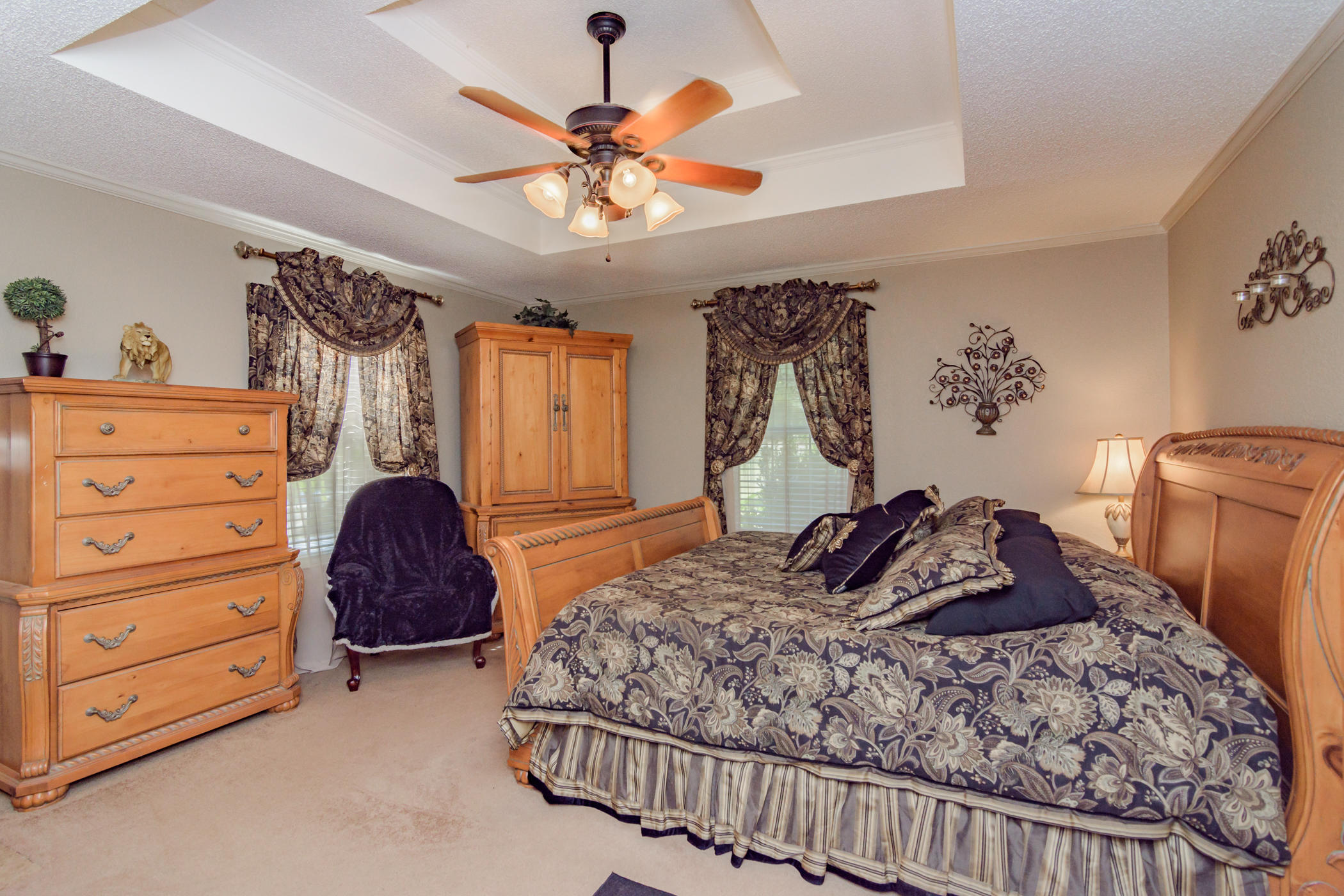 7262 Old River Road Baker, FL 32531 - Photo 22 of 63 a bedroom with a bed and a chandelier