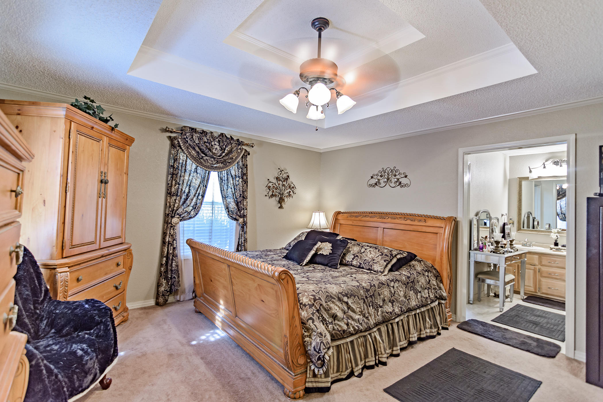 7262 Old River Road Baker, FL 32531 - Photo 23 of 63 a bedroom with a bed and a chandelier
