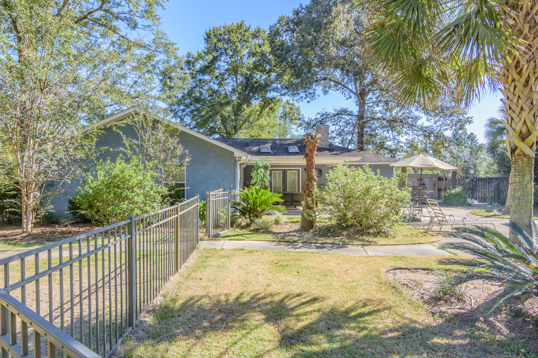 7262 Old River Road Baker, FL 32531 - Photo 30 of 63 a view of a house with a small yard