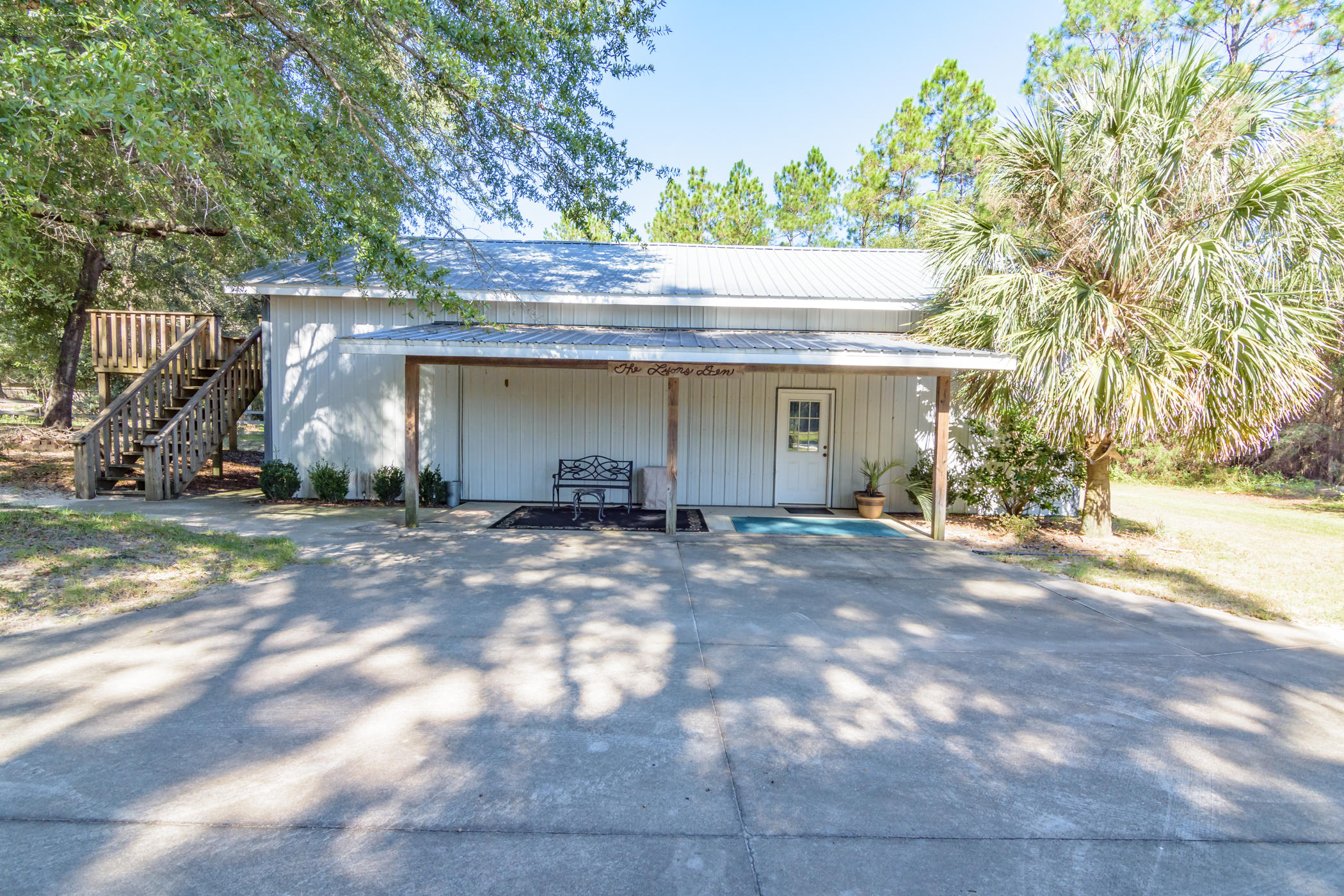 7262 Old River Road Baker, FL 32531 - Photo 34 of 63 a view of a house with a yard and garage