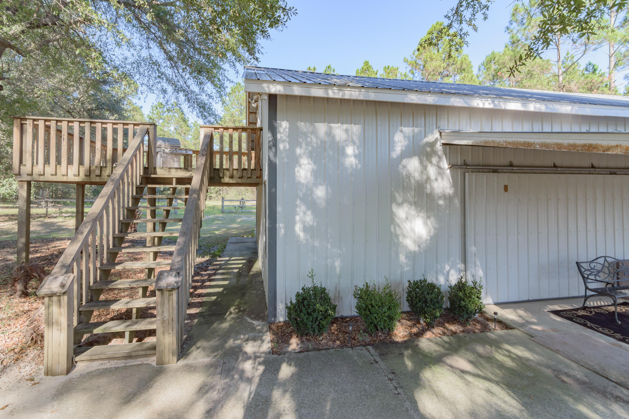 7262 Old River Road Baker, FL 32531 - Photo 36 of 63 a backyard of a house with plants and outdoor seating