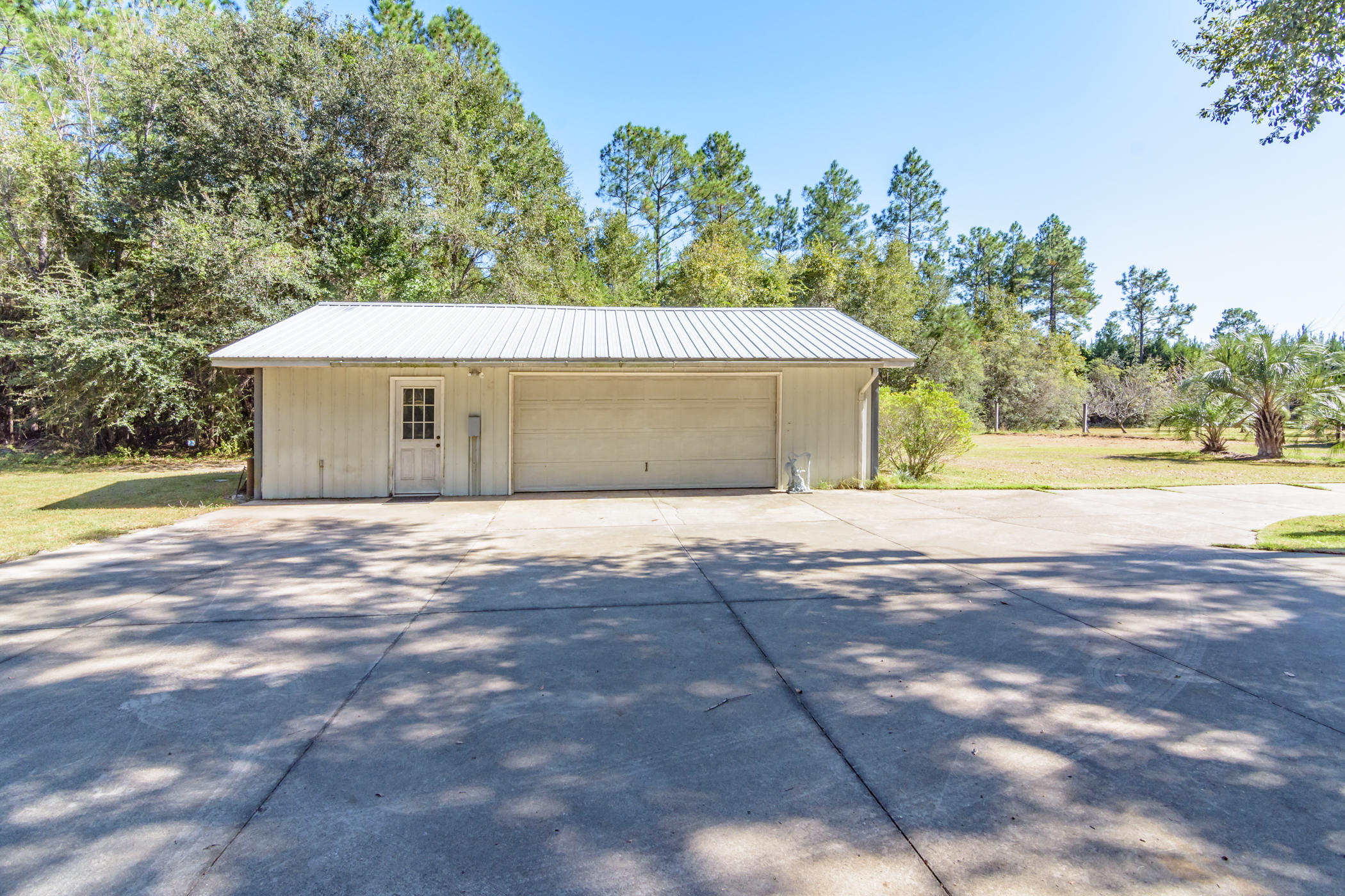 7262 Old River Road Baker, FL 32531 - Photo 46 of 63 a house with trees in the background