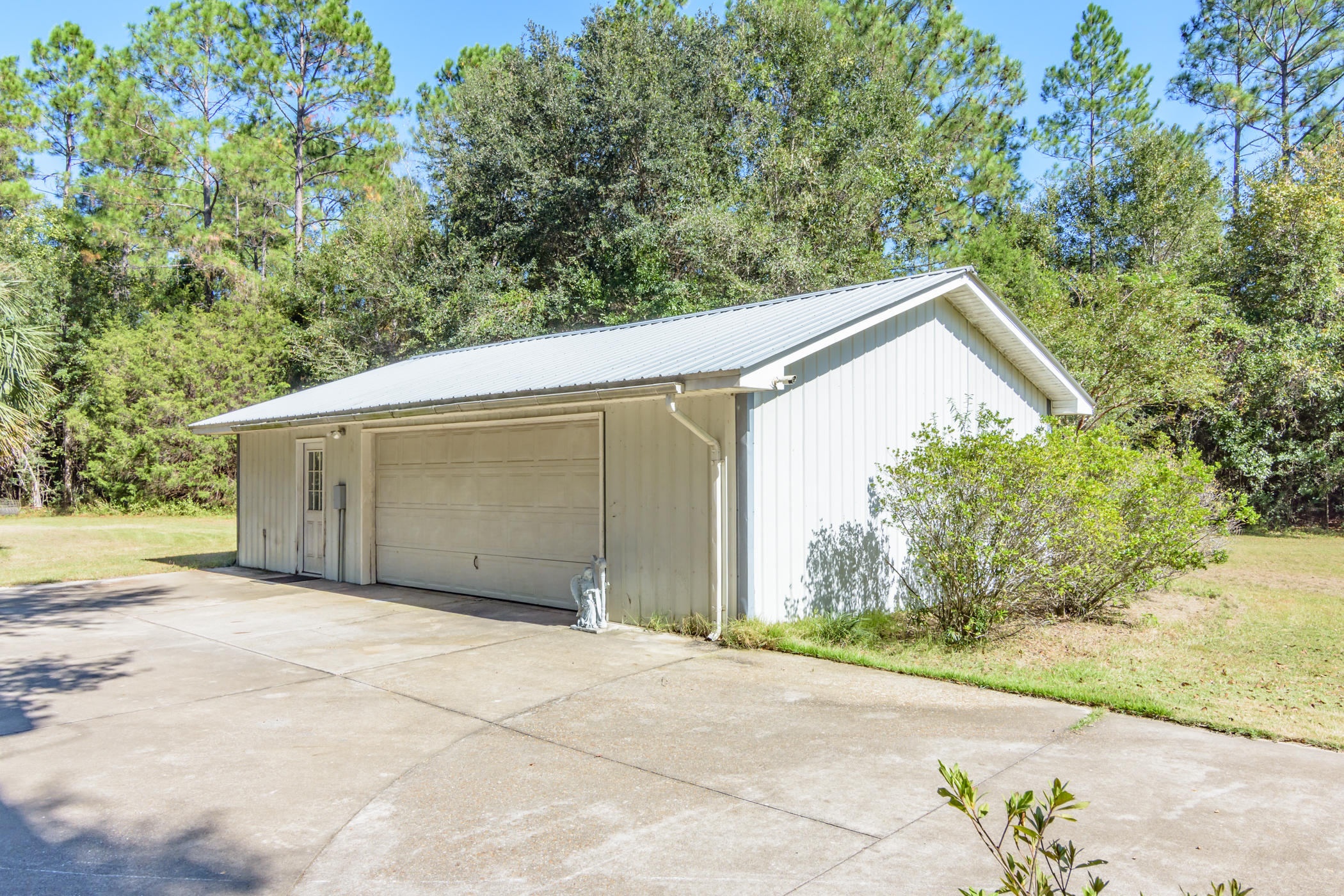 7262 Old River Road Baker, FL 32531 - Photo 47 of 63 a view of a house with a garage